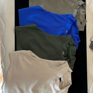 4 alo mint condition yoga tops. Size “M” $75 for all 4. Interior elastic band